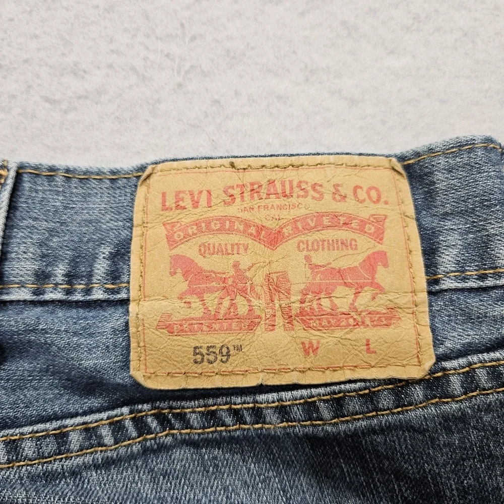 Levis 559 Relaxed Straight Jeans Mens 50x31 Blue Medium Wash Trucker Damaged